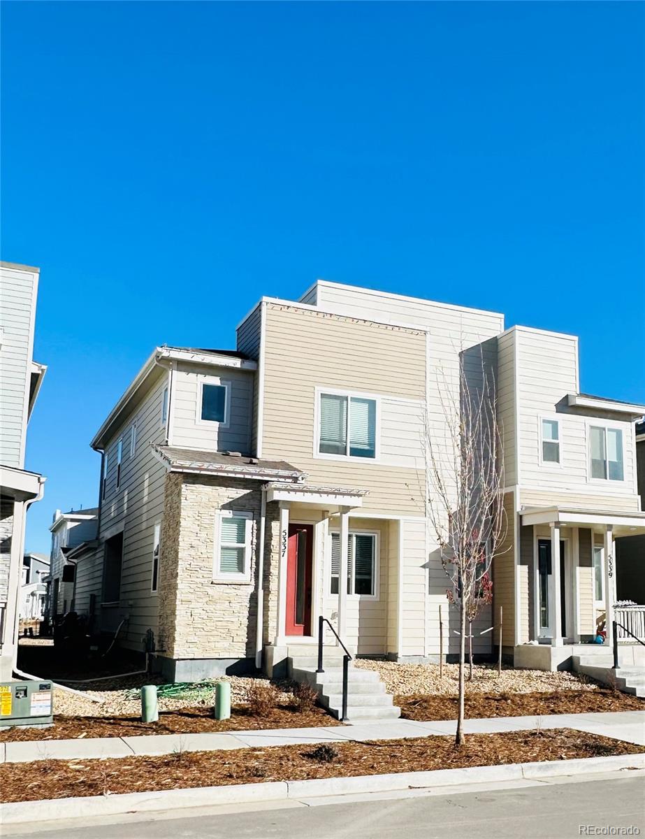 a view of a white building among the street