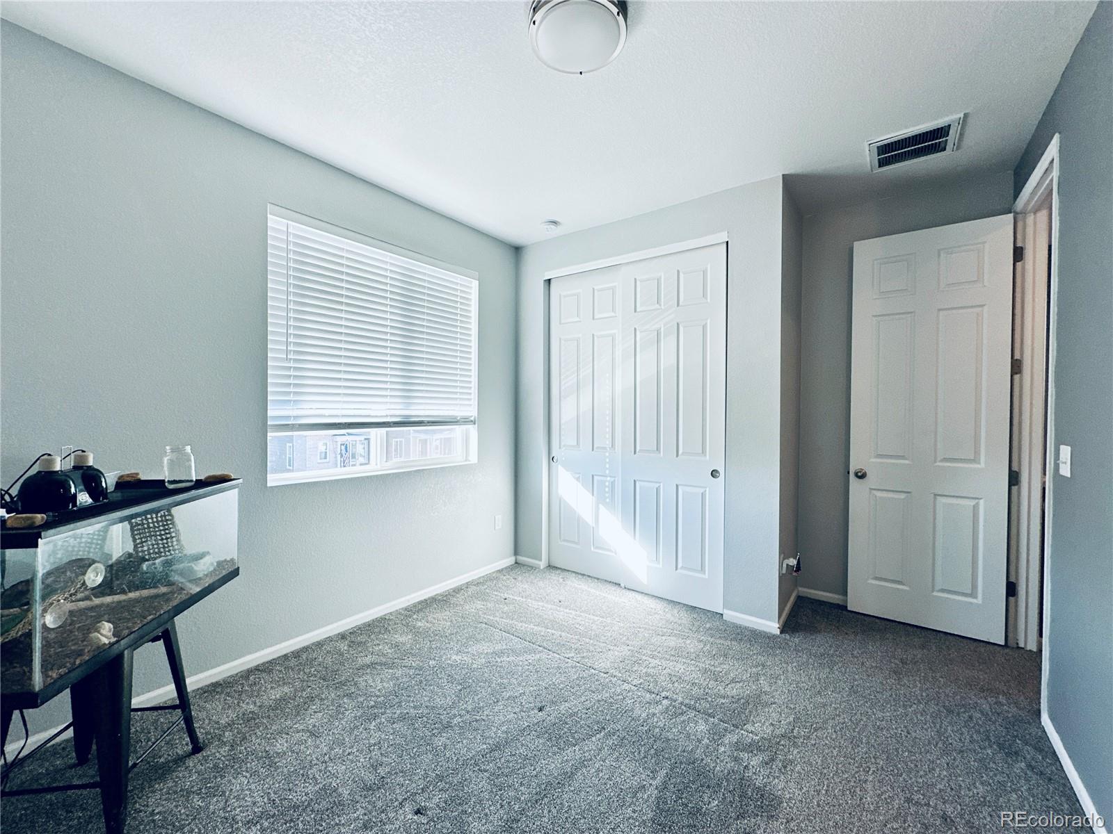 5337 Warrior Street Frederick, CO 80504 - Photo 13 of 17 a view of an empty room with a window