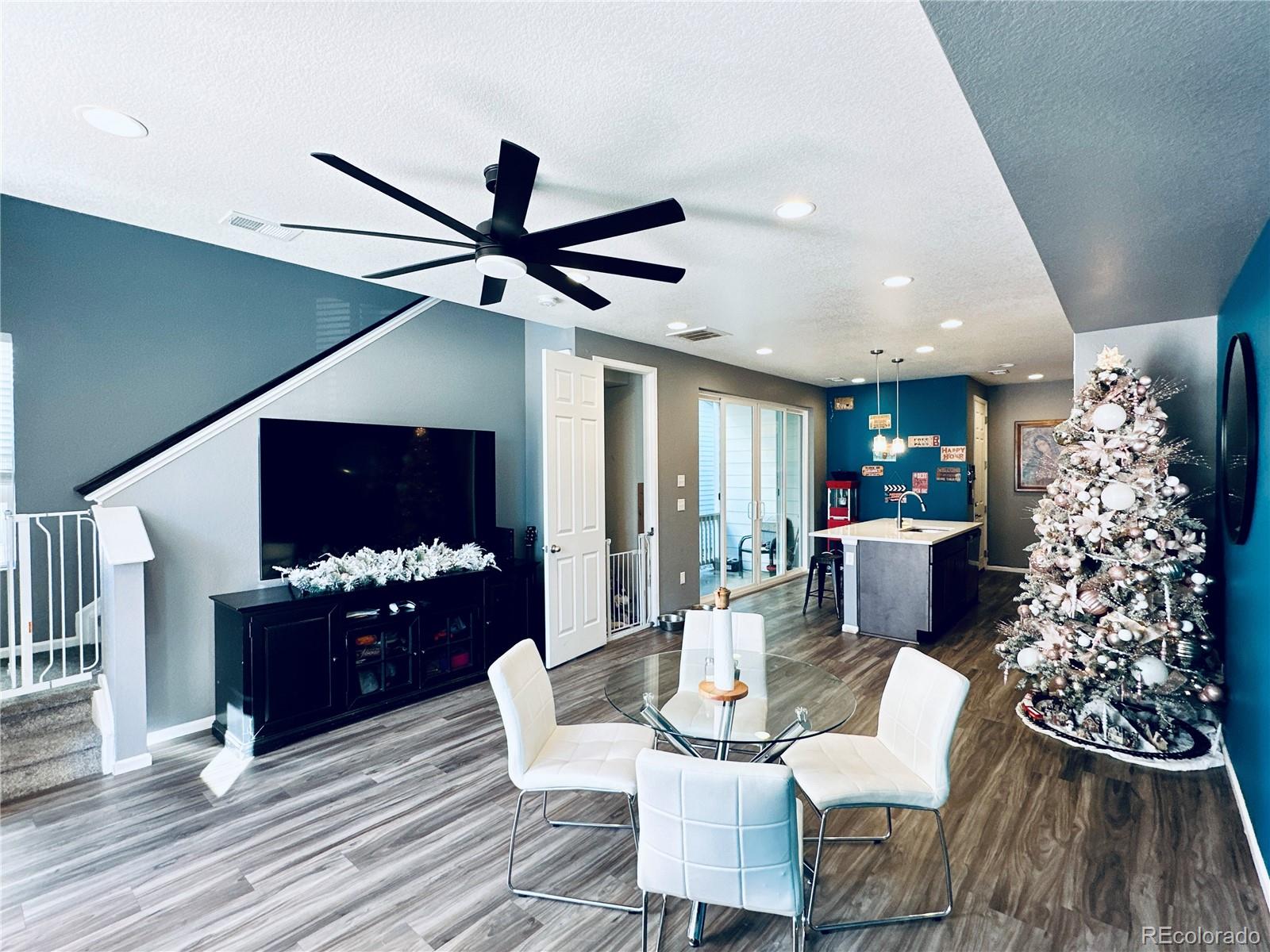 5337 Warrior Street Frederick, CO 80504 - Photo 2 of 17 a living room with fireplace furniture and a wooden floor