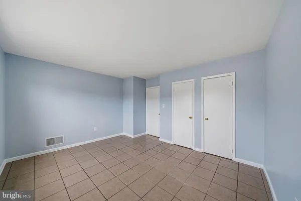 a bathroom with a sink a tub and a mirror