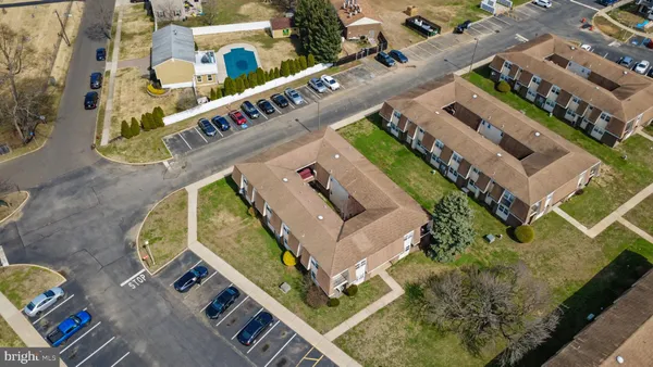 a view of a house with backyard and porch