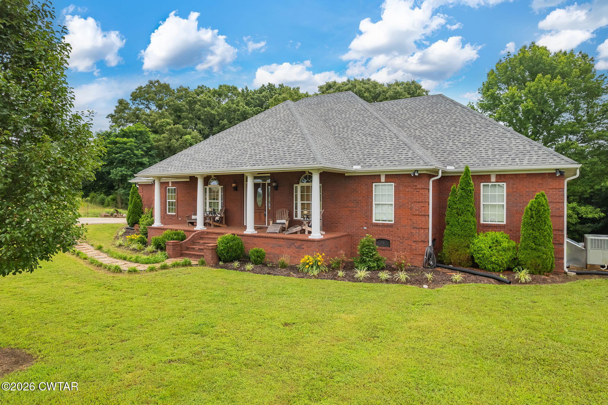 4320 Timberlake-Wildersville Road Lexington, TN 38351 - Photo 45 of 58 a view of a house with table and chairs in a patio