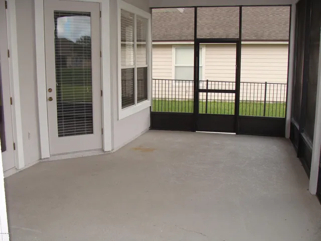 a bed sitting in front of a window