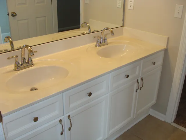 a bathroom with a sink and a mirror