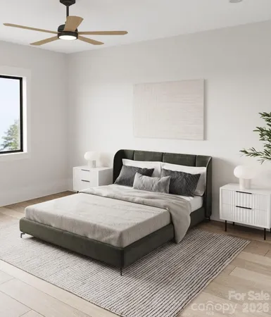 a bedroom with a bed and a ceiling fan