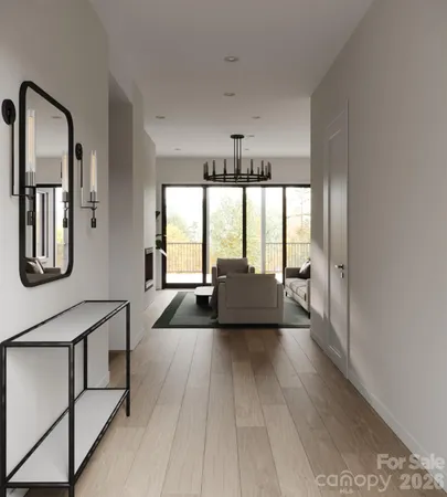 a living room with furniture and large windows