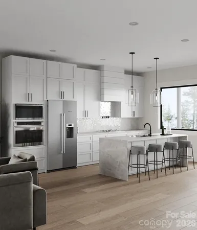 a large kitchen with cabinets table and chairs