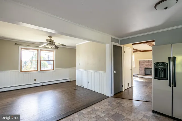 a view of a kitchen cabinets and wooden floor