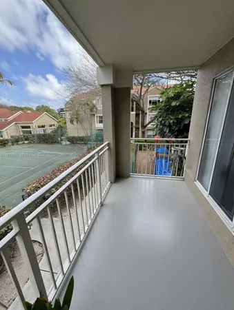 a view of balcony with furniture