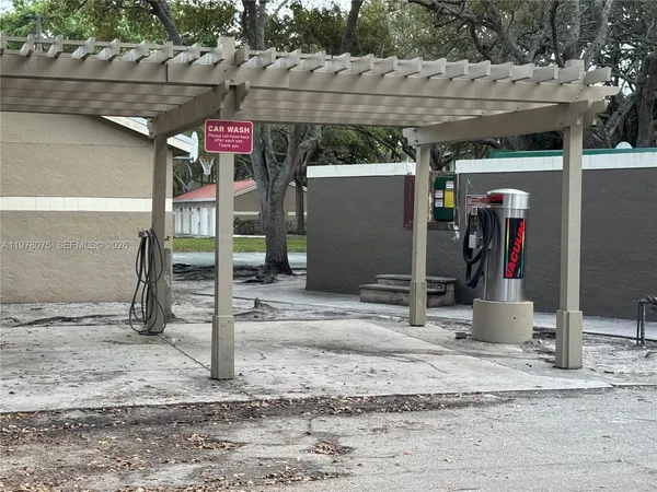a view of a parking space with a garage