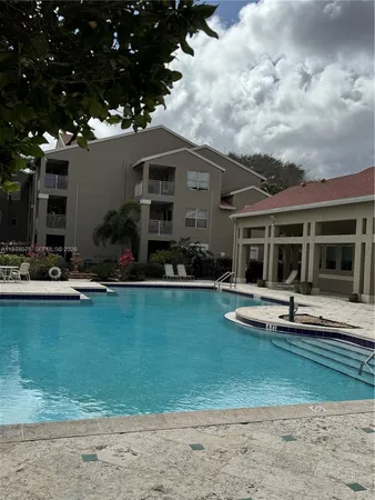 a front view of house with patio and garden