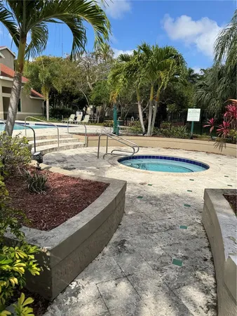 a view of a swimming pool with a house