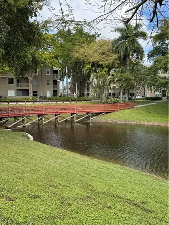 a view of swimming pool with outdoor seating and yard