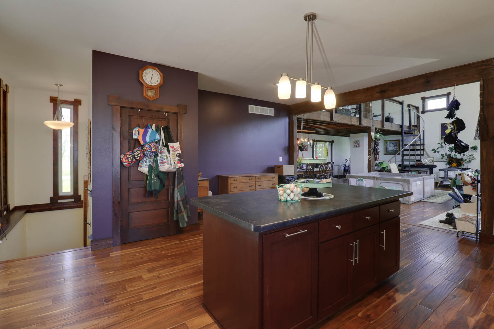 12014 Prairie Center Road Clinton, IL 61727 - Photo 11 of 56 a kitchen with stainless steel appliances granite countertop a sink stove and wooden floor