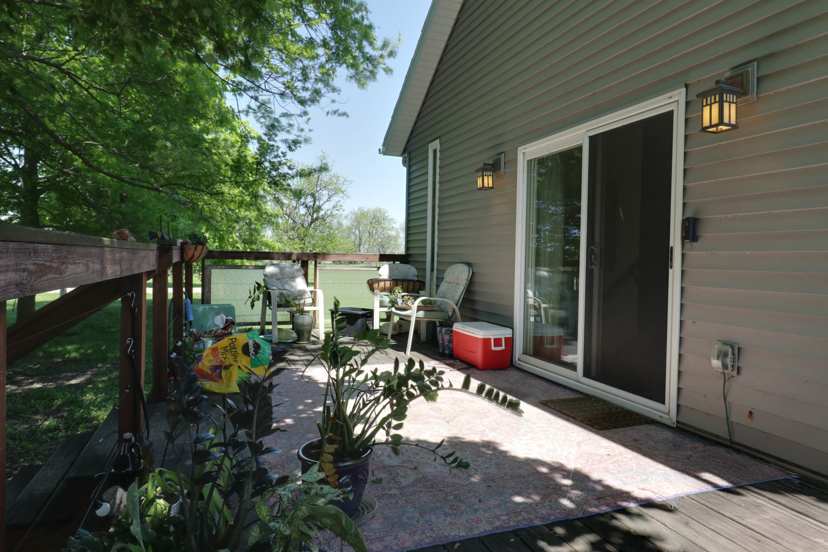 12014 Prairie Center Road Clinton, IL 61727 - Photo 38 of 56 a view of a patio with table and chairs and potted plants