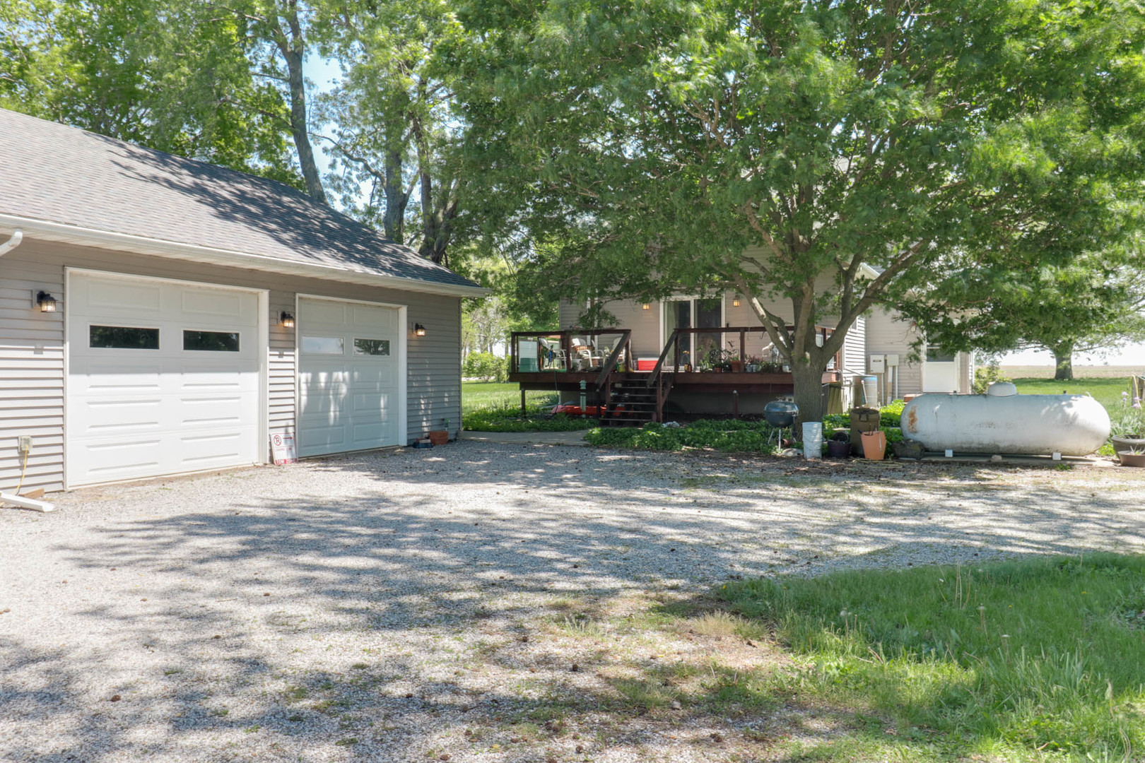 12014 Prairie Center Road Clinton, IL 61727 - Photo 46 of 56 a view of a house with a yard