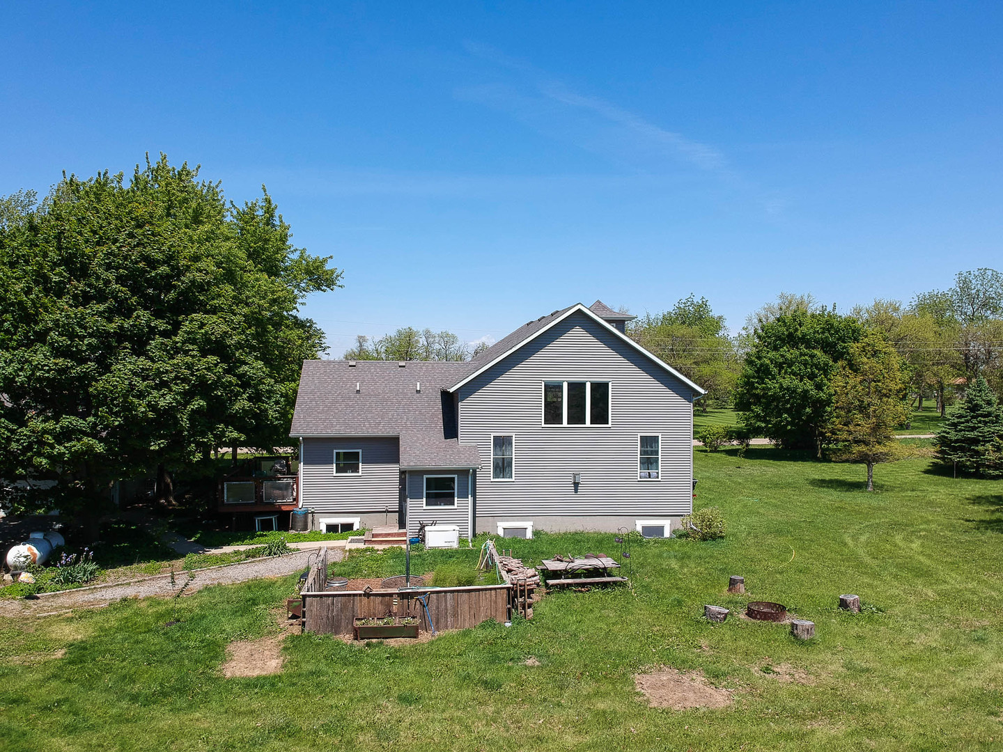 12014 Prairie Center Road Clinton, IL 61727 - Photo 47 of 56 a front view of house with yard and green space
