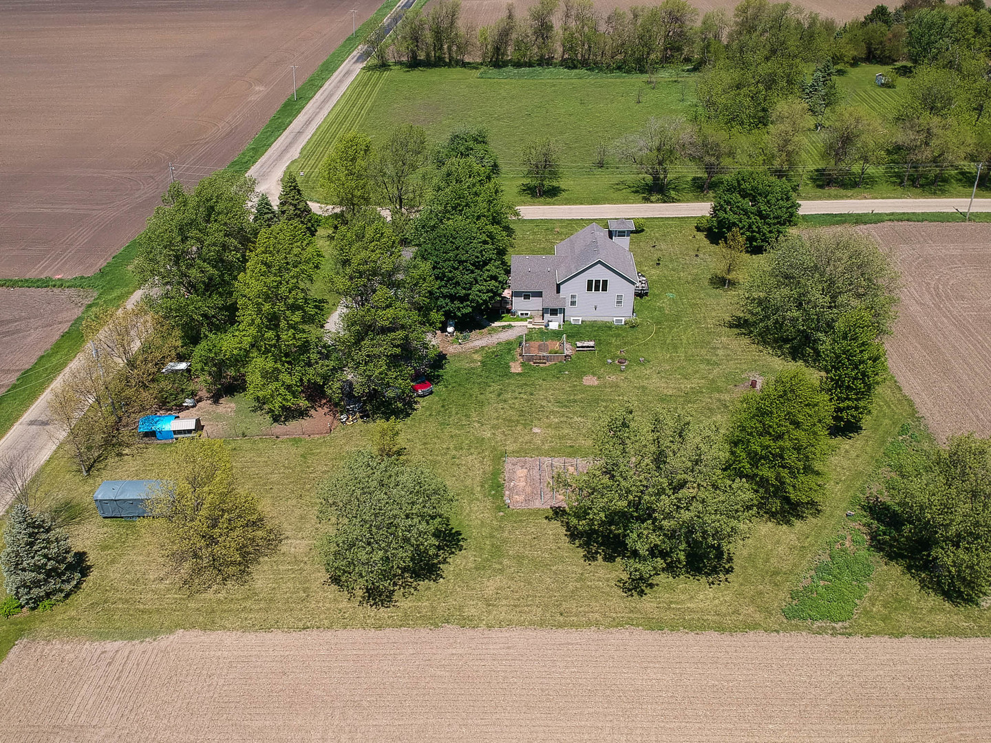 12014 Prairie Center Road Clinton, IL 61727 - Photo 55 of 56 an aerial view of a house with a yard and lake view