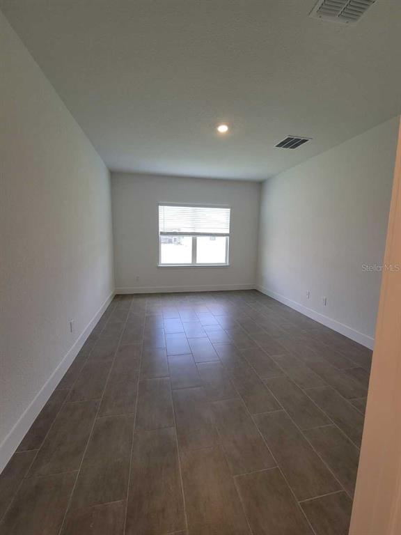 4380 Southwest 92nd Pl Road Ocala, FL 34476 - Photo 19 of 57 an empty room with windows