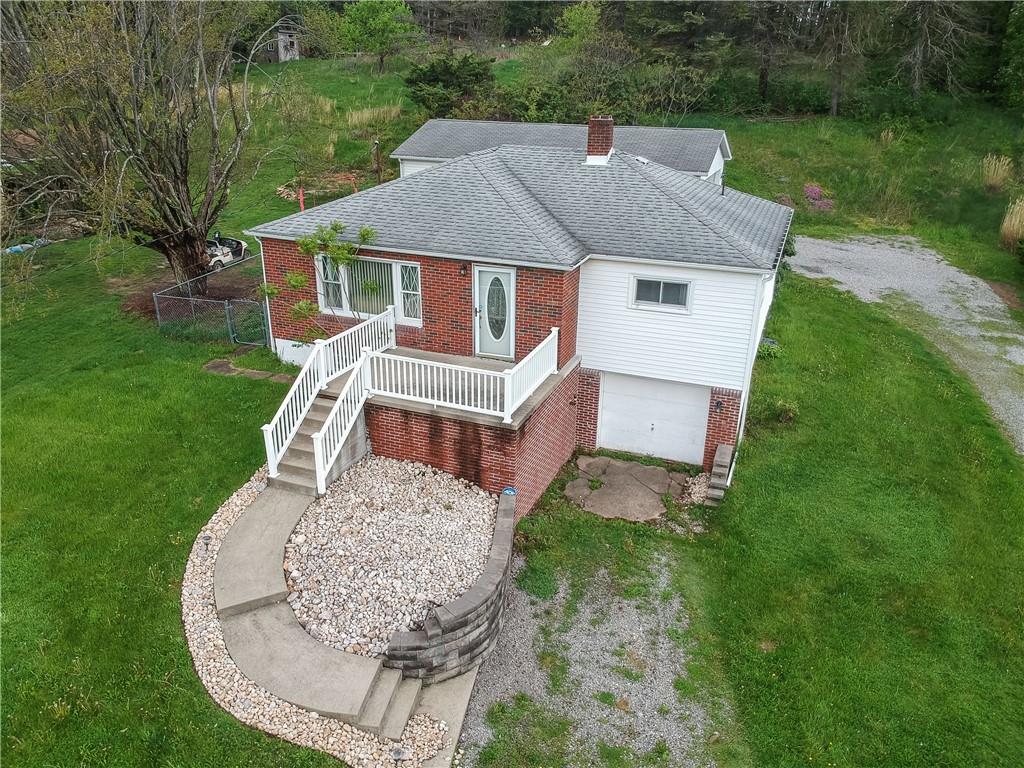 109 Staff Road Slippery Rock, PA 16057 - Photo 1 of 20 a aerial view of a house with a yard patio and deck