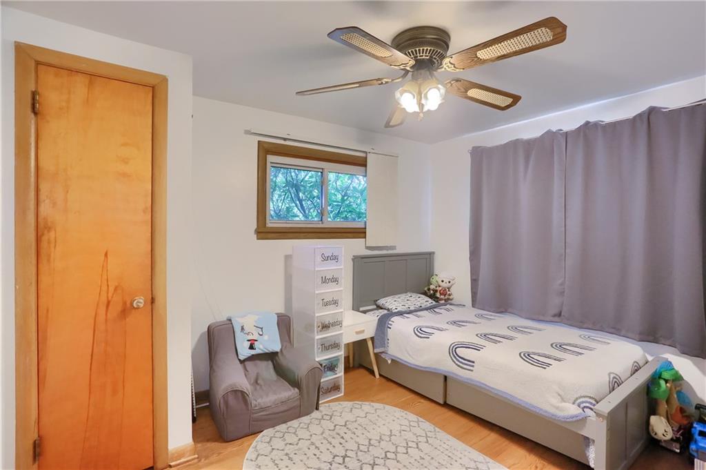 109 Staff Road Slippery Rock, PA 16057 - Photo 11 of 20 a bedroom with a bed and a chandelier