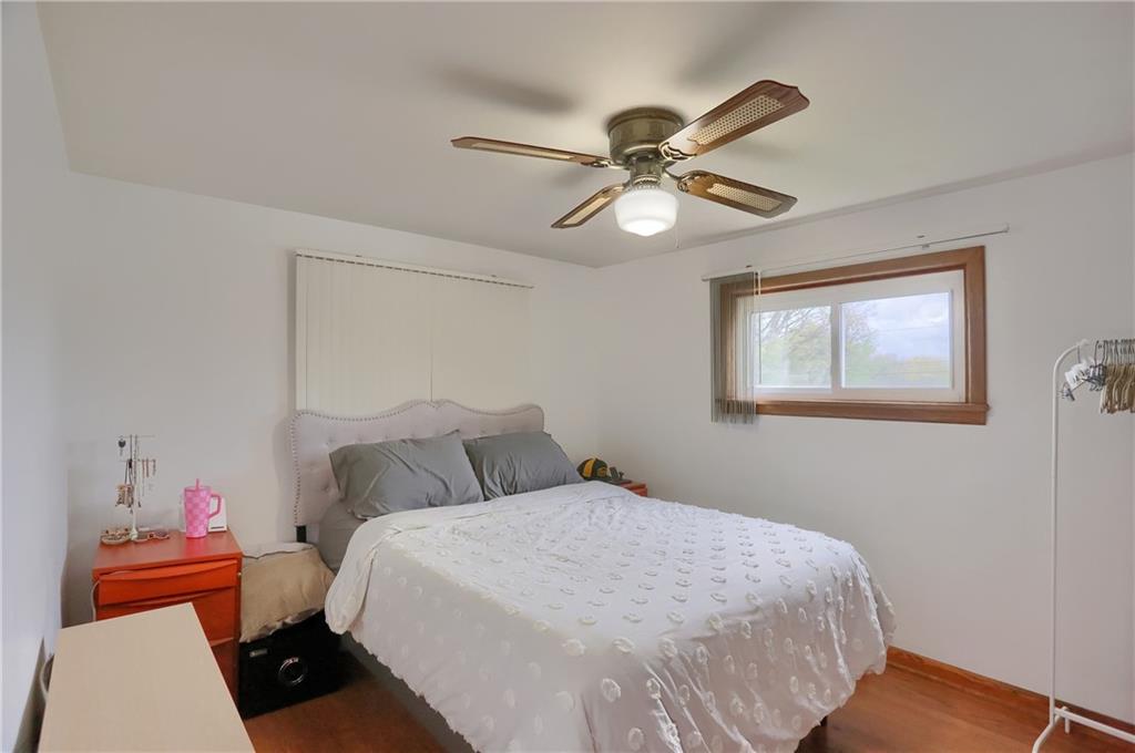 109 Staff Road Slippery Rock, PA 16057 - Photo 9 of 20 a bedroom with a bed and a chandelier
