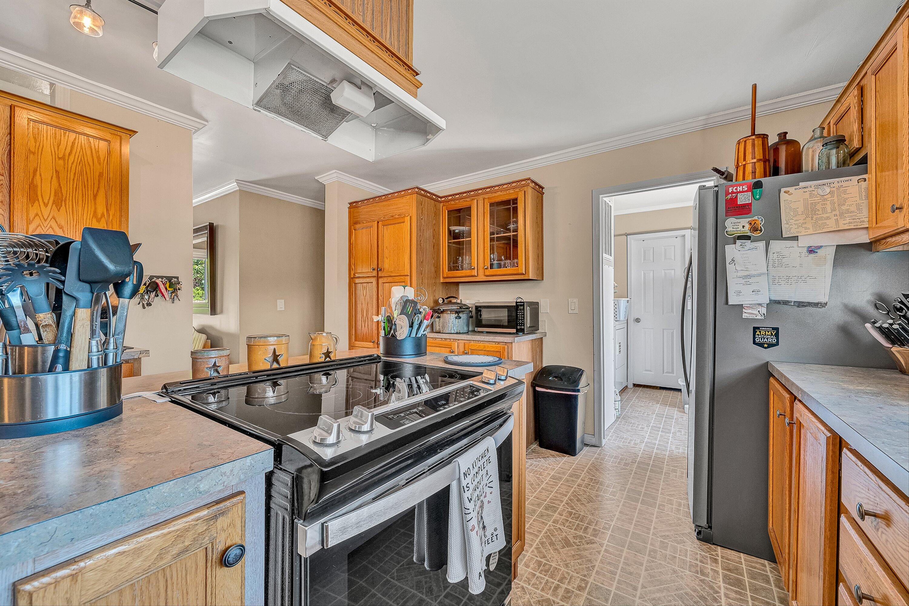 159 Simmons Creek Road Union Hall, VA 24176 - Photo 14 of 55 a kitchen that has a stove and a table