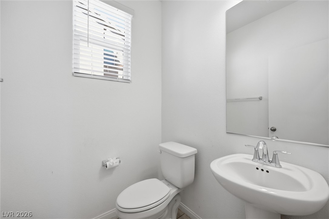 1811 Lincoln Road Las Vegas, NV 89115 - Photo 25 of 30 Half bath with toilet and baseboards