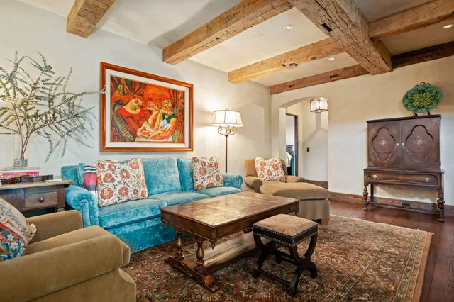 a bedroom with a bed and chair