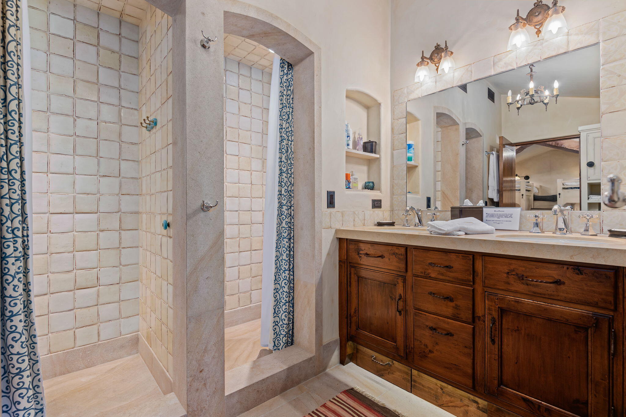 1915 Monte Allegro Drive Carpinteria, CA 93013 - Photo 30 of 59 a bathroom with a double vanity sink mirror and shower