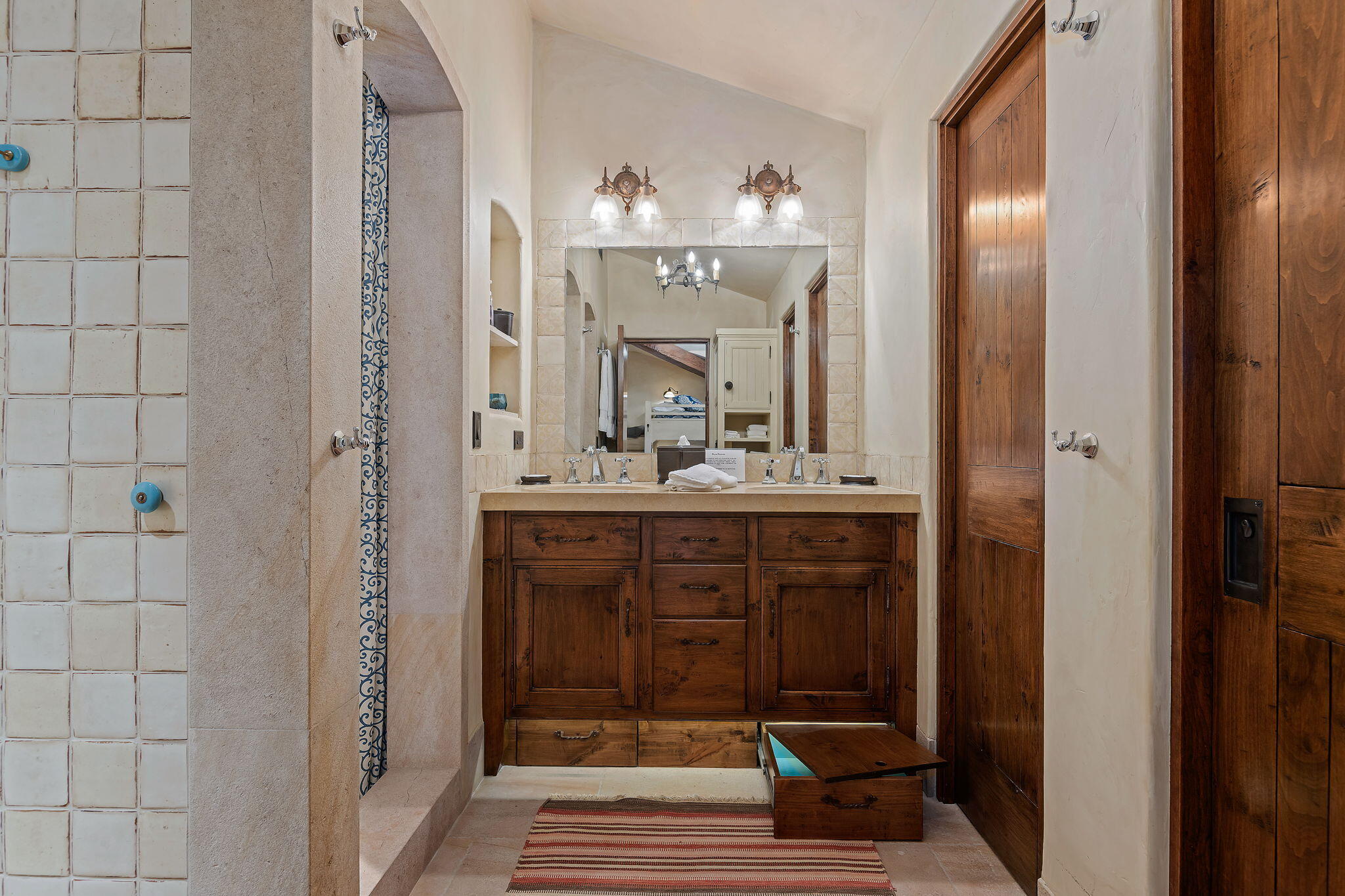 1915 Monte Allegro Drive Carpinteria, CA 93013 - Photo 31 of 59 a bathroom with a sink vanity and a mirror