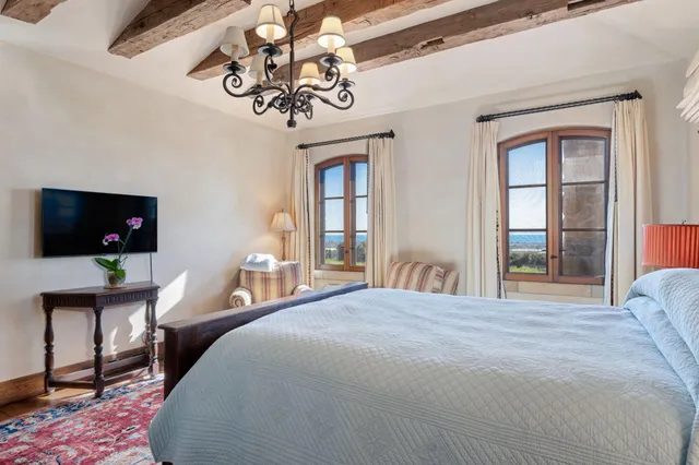 a livingroom with workspace and a window