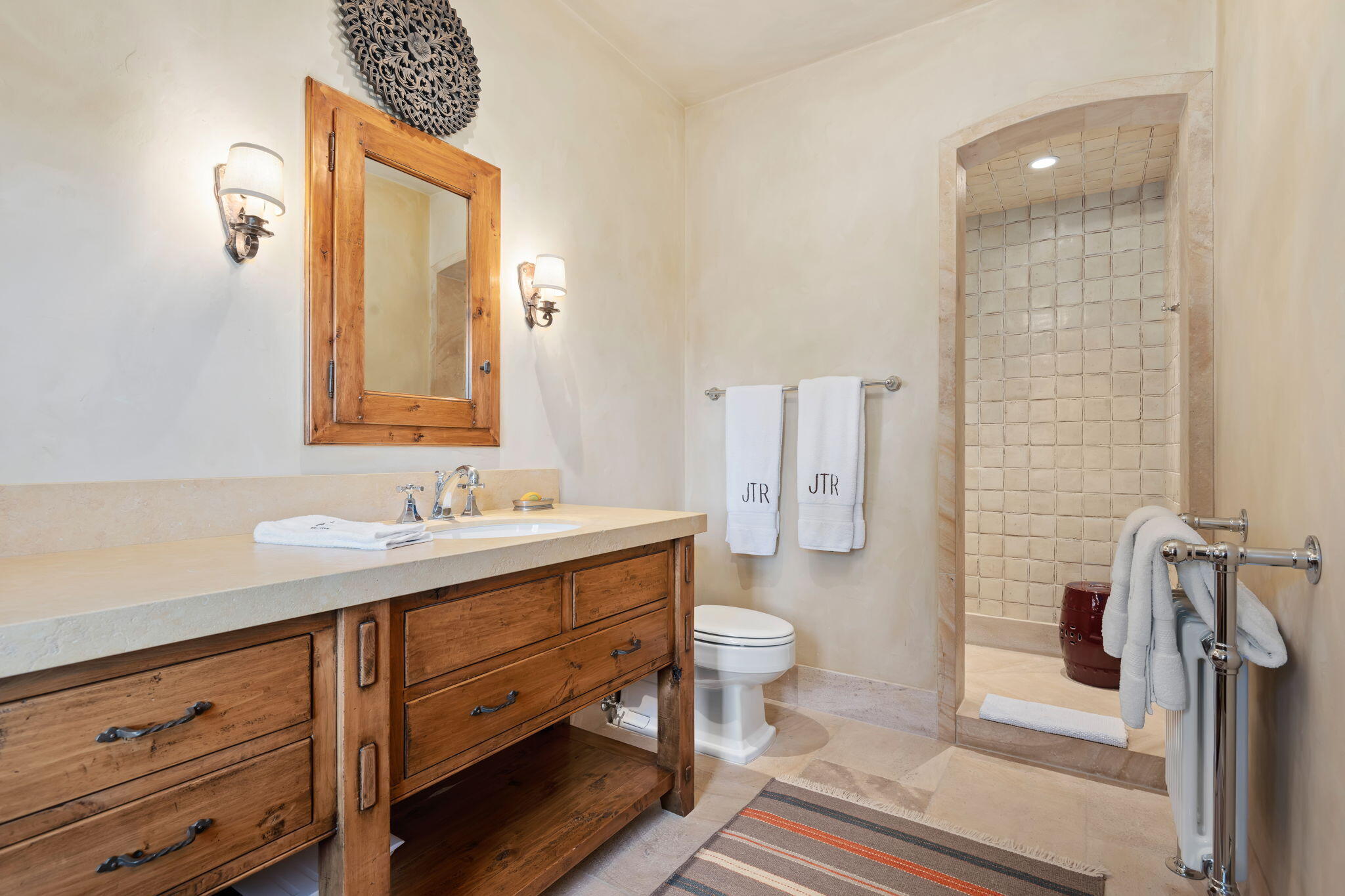 1915 Monte Allegro Drive Carpinteria, CA 93013 - Photo 34 of 59 a bathroom with a sink a toilet and shower