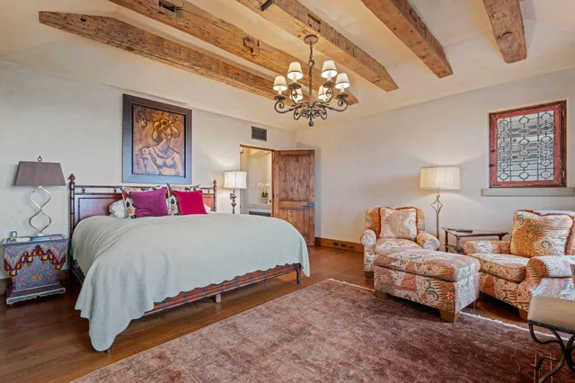 a living room with furniture a couch and dresser