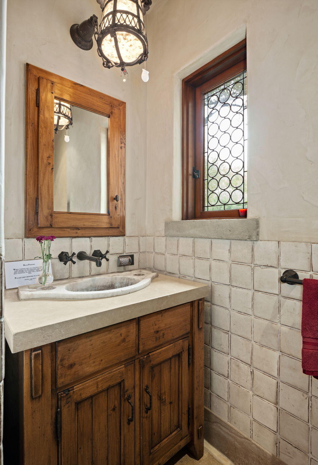1915 Monte Allegro Drive Carpinteria, CA 93013 - Photo 43 of 59 a bathroom with a sink and a mirror