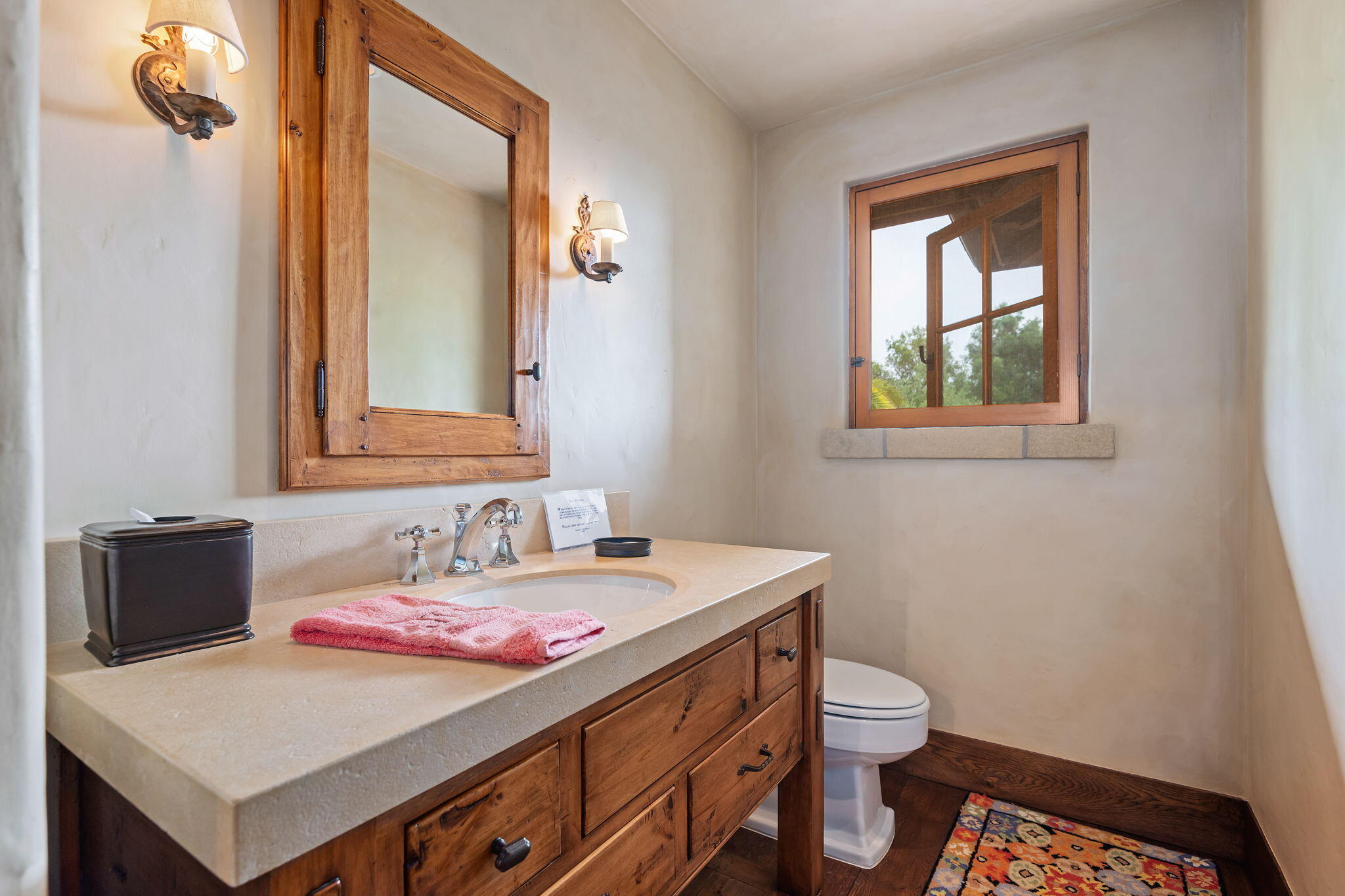 1915 Monte Allegro Drive Carpinteria, CA 93013 - Photo 45 of 59 a bathroom with a sink a toilet and mirror