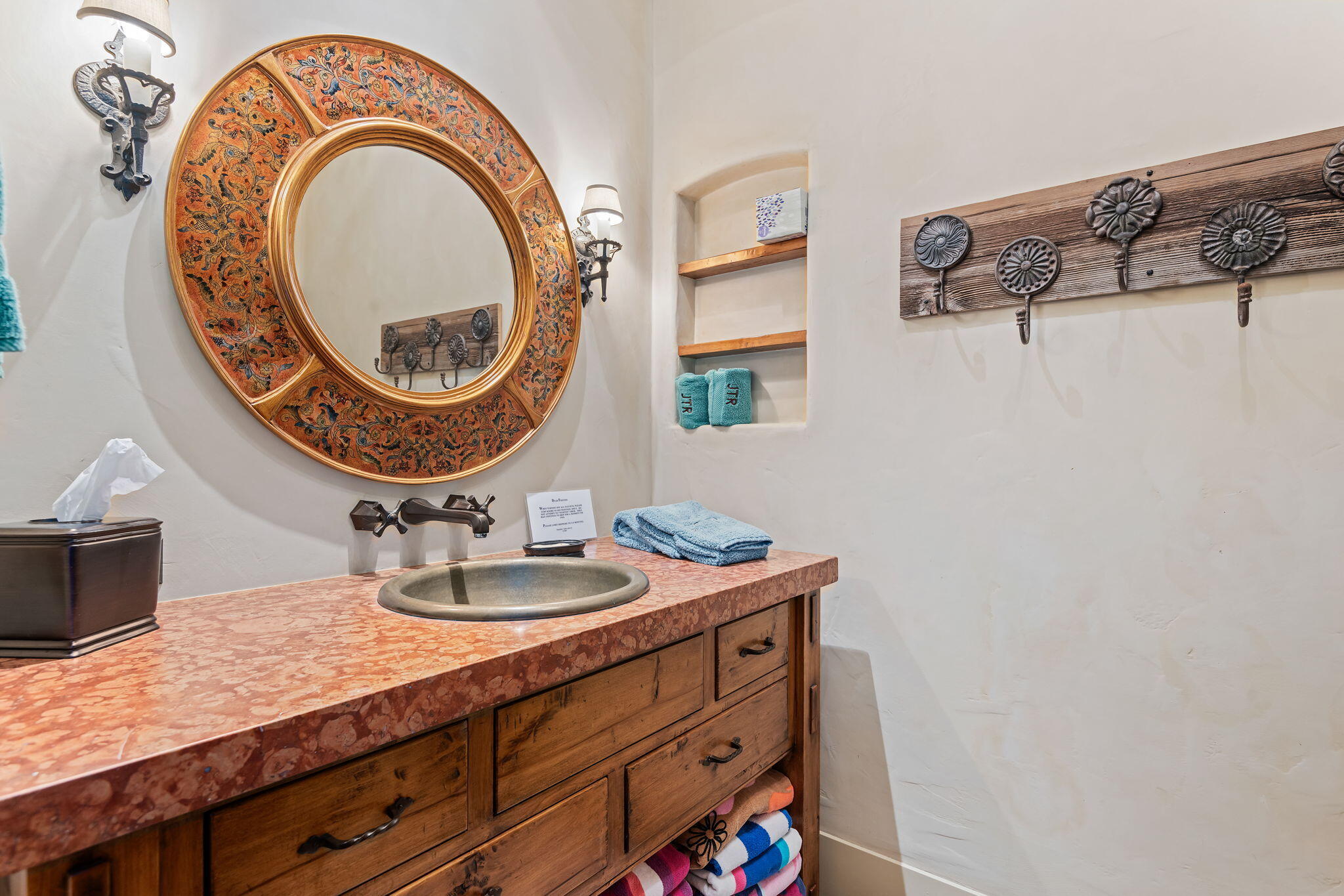 1915 Monte Allegro Drive Carpinteria, CA 93013 - Photo 47 of 59 a bathroom with a sink a mirror and a toilet
