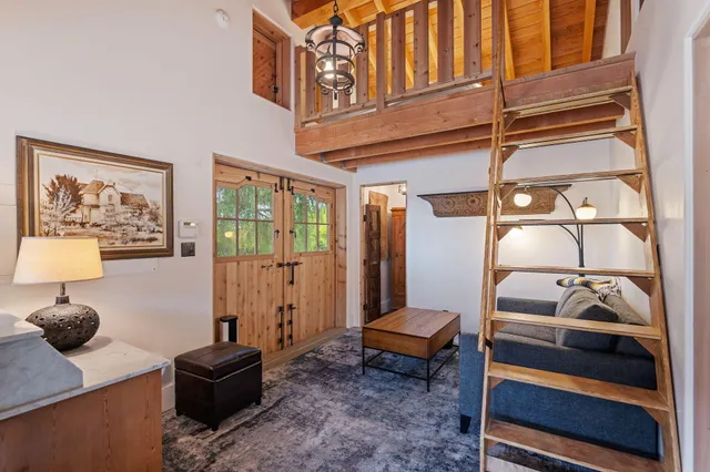 a view of a patio with table and chairs and potted plants