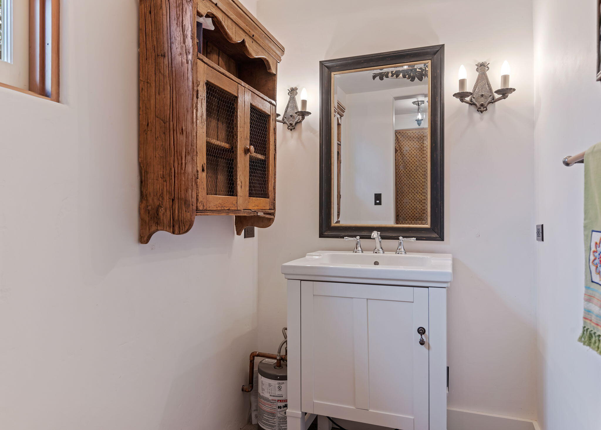 1915 Monte Allegro Drive Carpinteria, CA 93013 - Photo 49 of 59 a bathroom with a sink and a mirror