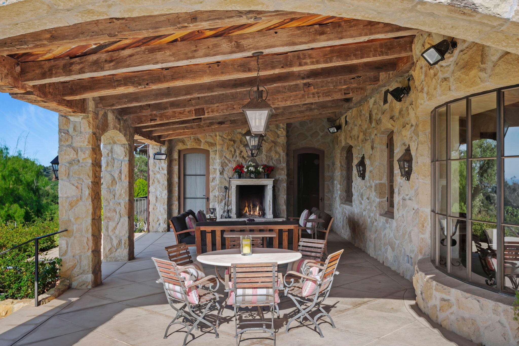 1915 Monte Allegro Drive Carpinteria, CA 93013 - Photo 50 of 59 a view of a patio with a table and chairs and potted plants