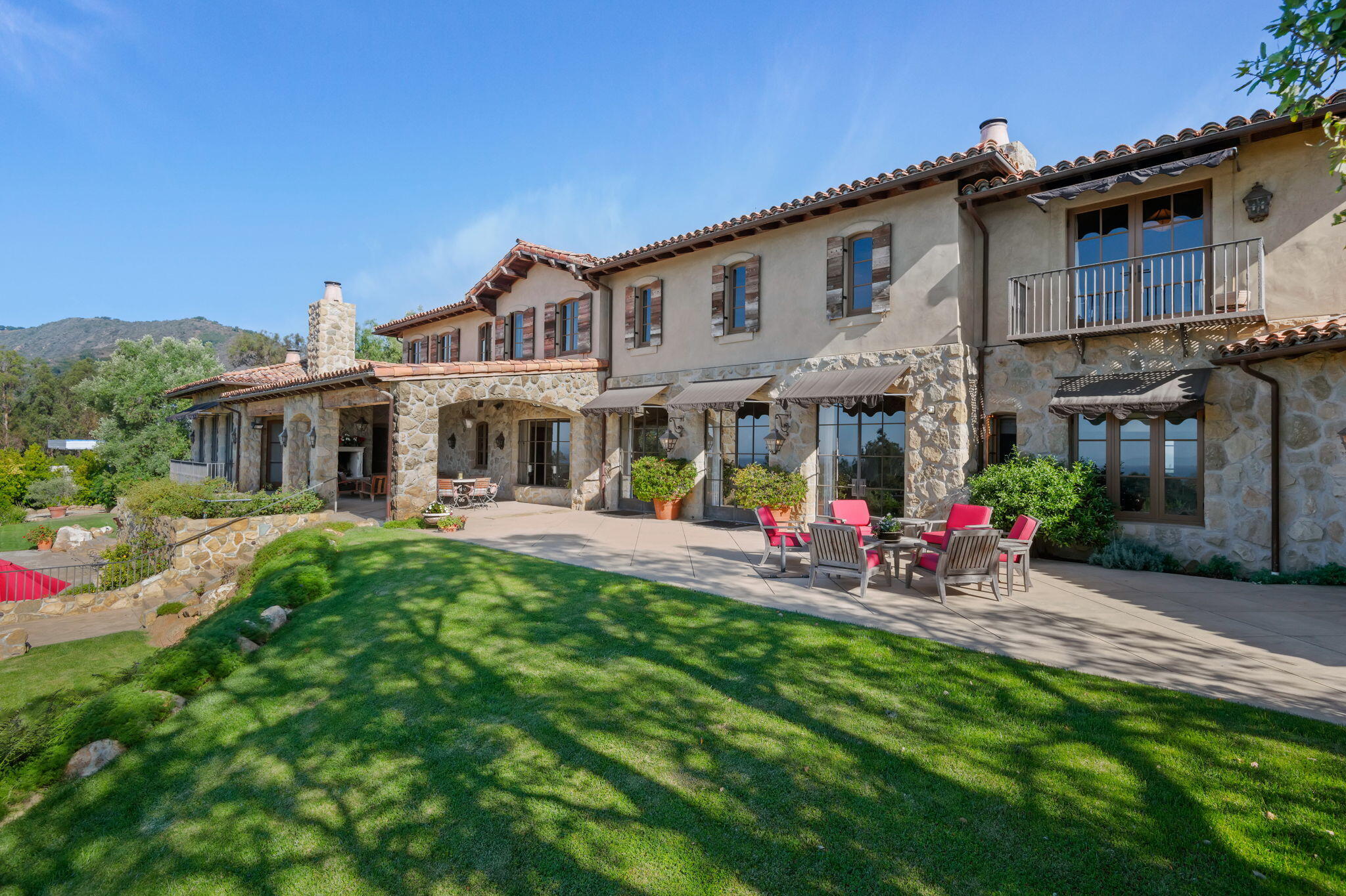 1915 Monte Allegro Drive Carpinteria, CA 93013 - Photo 56 of 59 a view of a house with a yard patio and fire pit