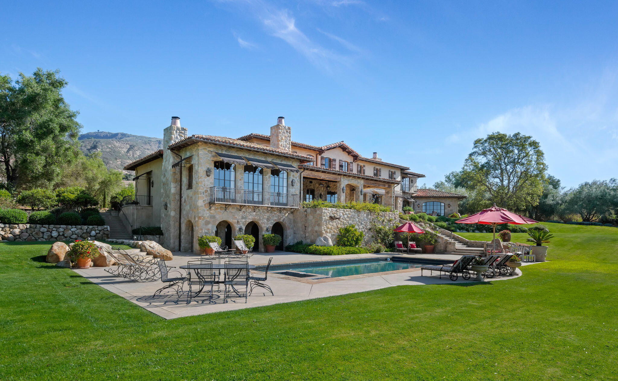 1915 Monte Allegro Drive Carpinteria, CA 93013 - Photo 57 of 59 a view of a house with a yard and sitting area