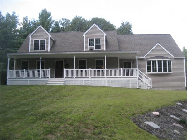 77 Hastings Road Ashburnham, MA 01430 - Photo 1 of 28 a front view of a house with a garden