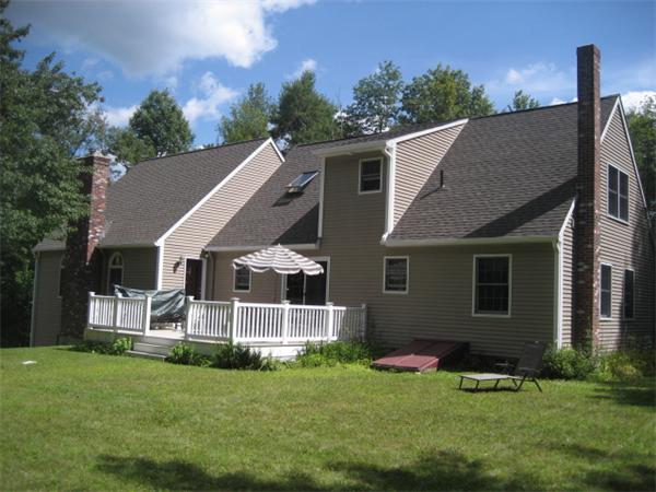 77 Hastings Road Ashburnham, MA 01430 - Photo 17 of 28 a view of a house with a yard