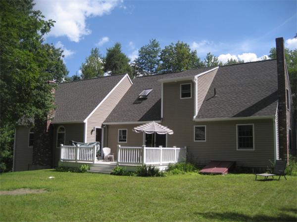 77 Hastings Road Ashburnham, MA 01430 - Photo 18 of 28 a front view of house with yard and green space