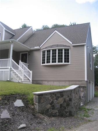77 Hastings Road Ashburnham, MA 01430 - Photo 23 of 28 a front view of a house with a yard