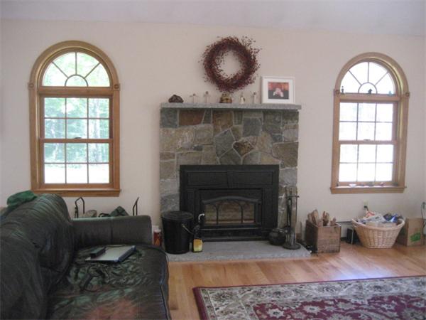 77 Hastings Road Ashburnham, MA 01430 - Photo 5 of 28 a living room with furniture and a fireplace