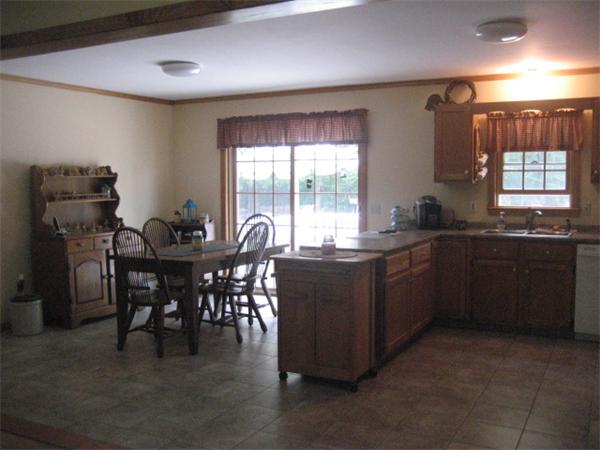 77 Hastings Road Ashburnham, MA 01430 - Photo 8 of 28 a kitchen with a table and chairs in it