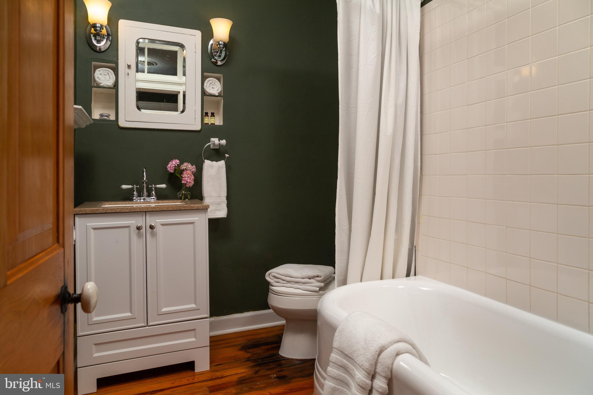 205 Cherry Street St. Michaels, MD 21663 - Photo 34 of 64 a bathroom with a sink and a toilet