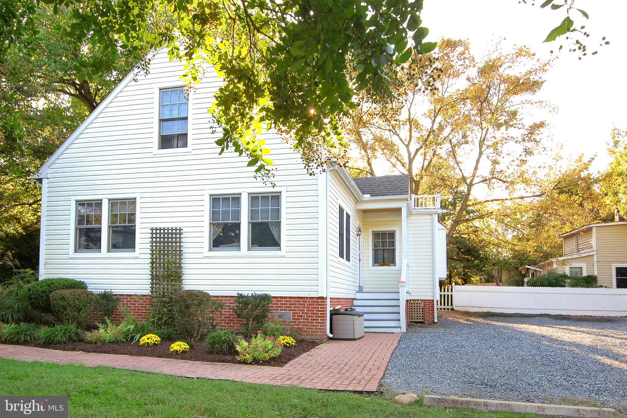 205 Cherry Street St. Michaels, MD 21663 - Photo 42 of 64 a front view of a house with garden